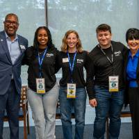 Kala Gibson, President Mantella and group of event attendees